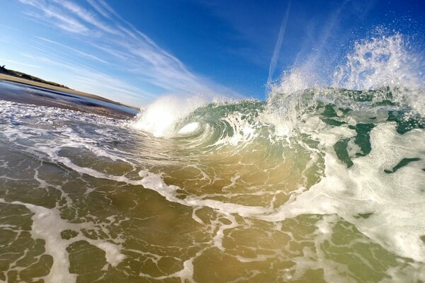 A pipe made of waves against a blue sky background