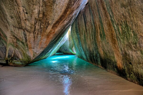 Blue ocean water next to a rock