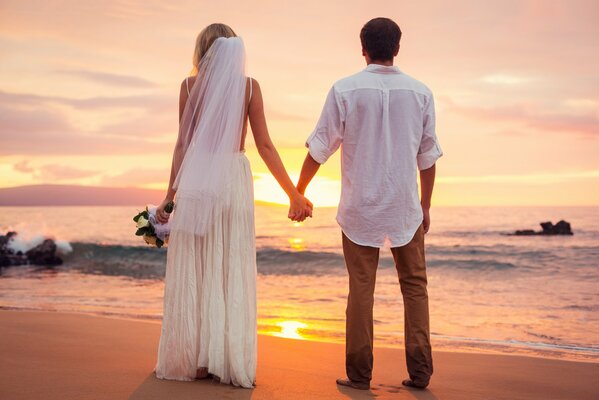 Wedding vacation at sunset by the sea