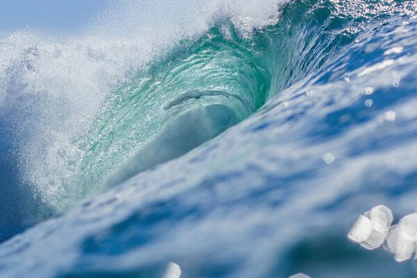 The azure wave shines in the light of the sun