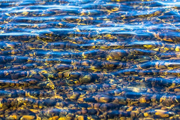 Clear water with stones on the bottom