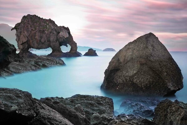 Turquoise-colored sea around an elephant-shaped rock