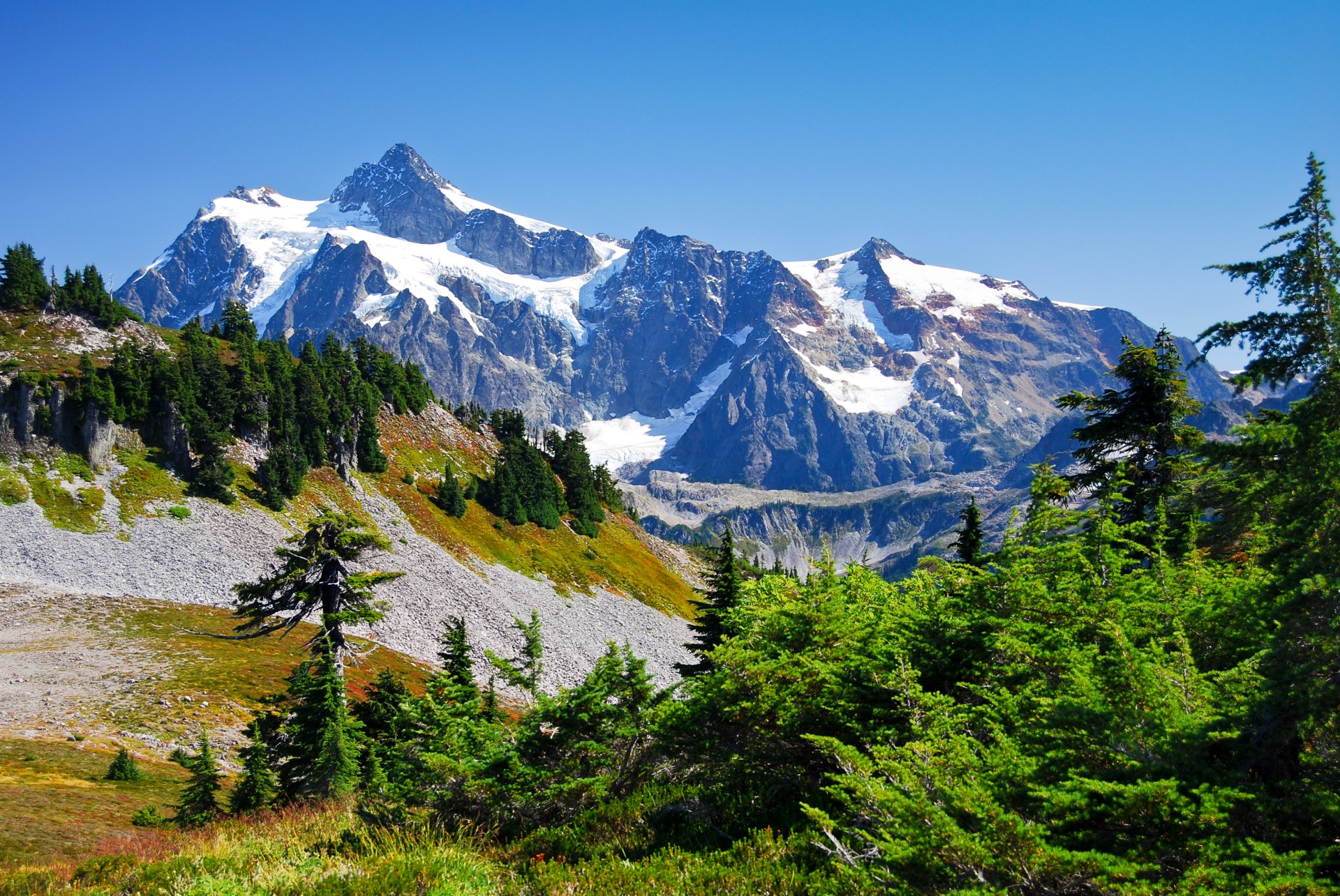 mountain tops snow valley tree sky