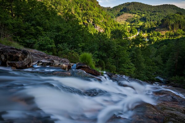 Waterfall among the rocks and forests