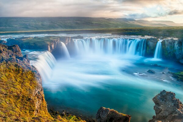 There is a large waterfall in the valley