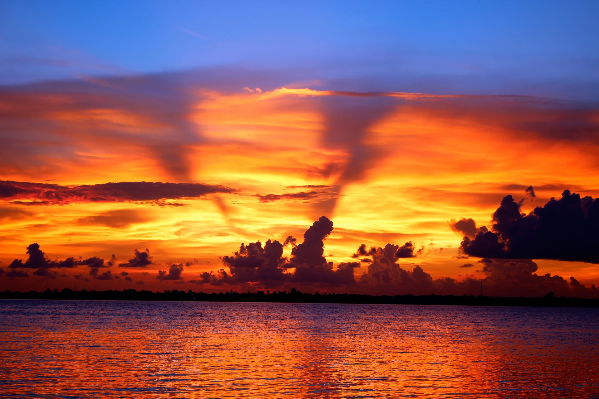 unset clouds water wave