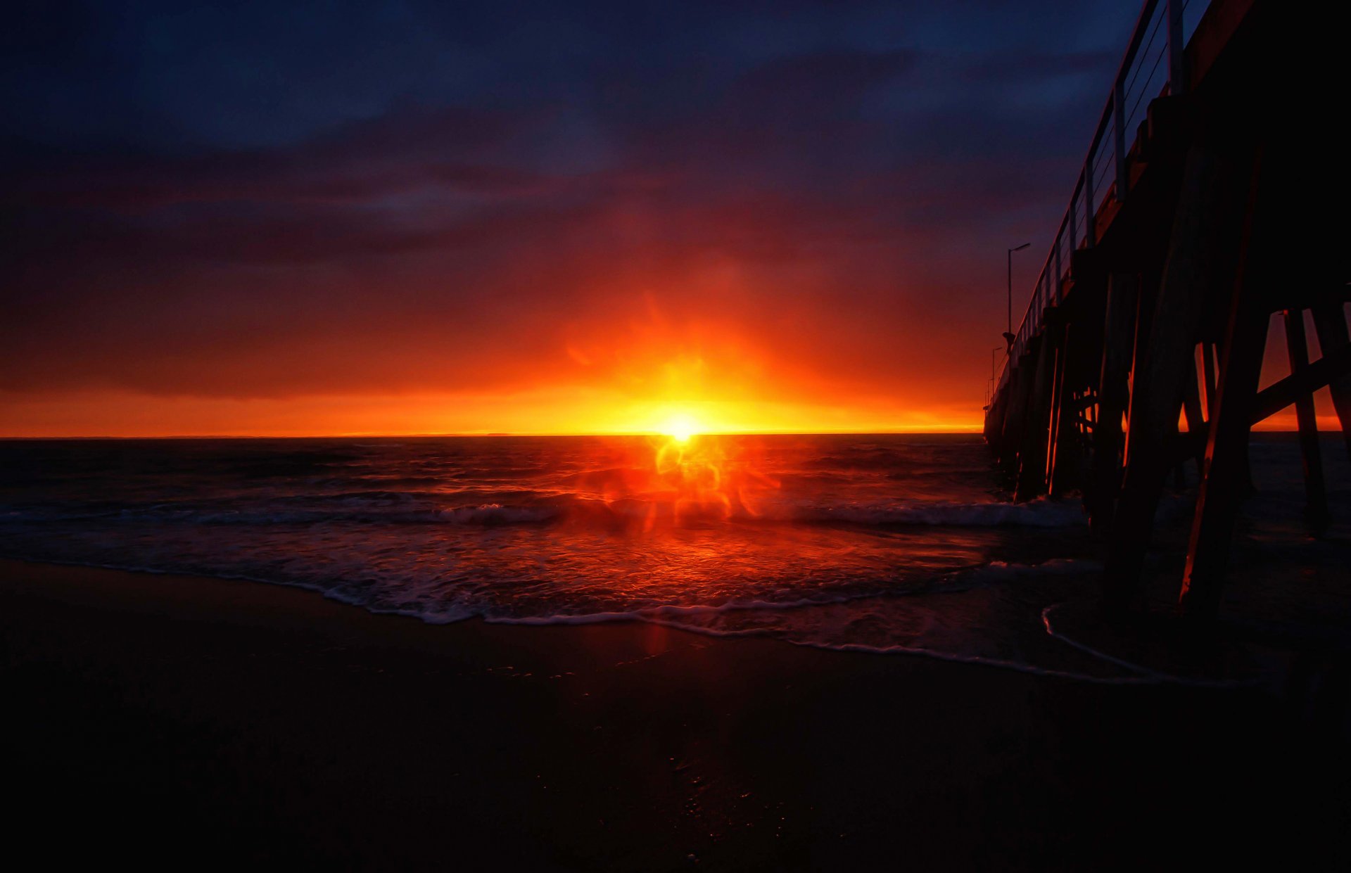 puesta de sol muelle surf