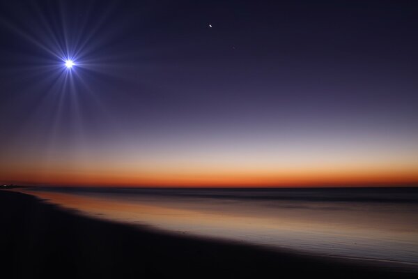 Glowing moon and night beach