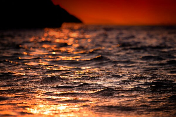 The brilliance of the sun plays on the waves