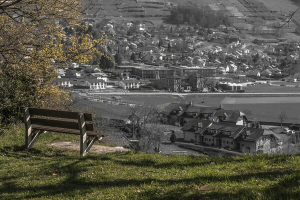 View from the bench on the city. Contrast of landscapes