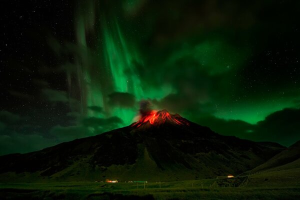 Volcanic eruption under the Northern Lights