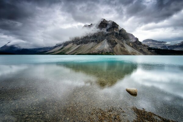 The mountain towering menacingly over the lake