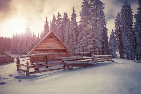 A snow-covered house on the edge of the earth