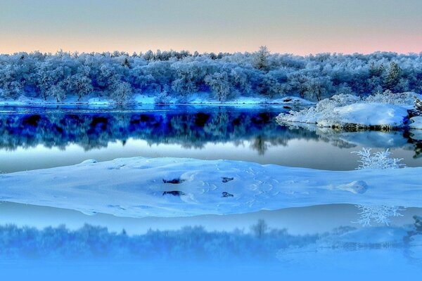 The winter river is covered with ice