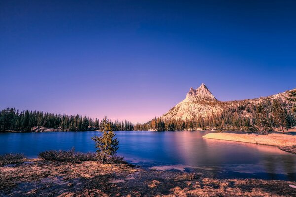 Lake at the foot of the mountain with a beautiful sky