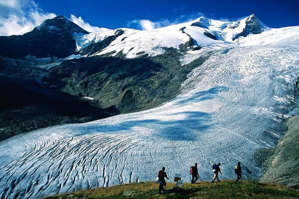 Tourists on the background of Alpine landscapes