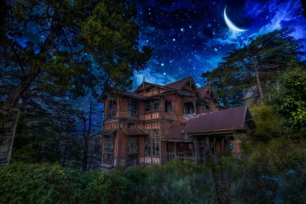 An old house in the dark and a starry sky