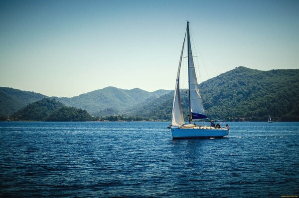 A slow sailing sail on the sea