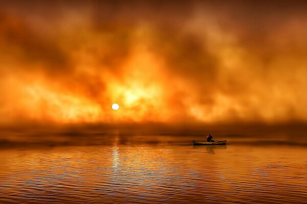 Al amanecer en la niebla, el hombre en el barco