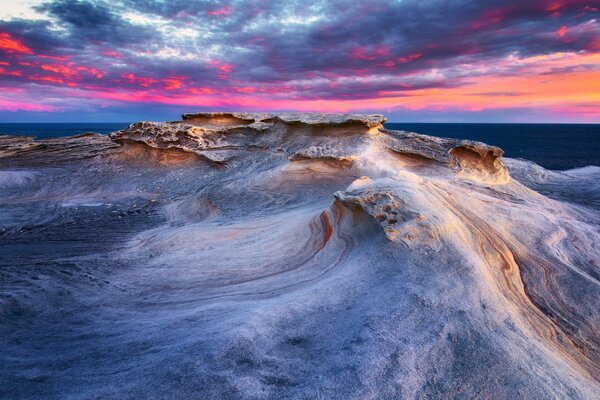 Beautiful waves at a colorful sunset