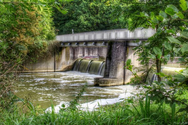 A bridge with a dam on a river in Germany