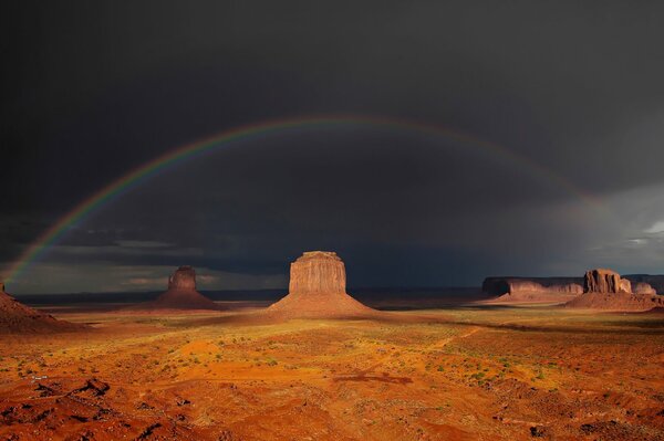 Rainbow over rocky terrain