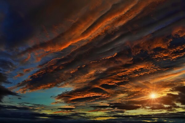 Sunset sky with picturesque burning clouds