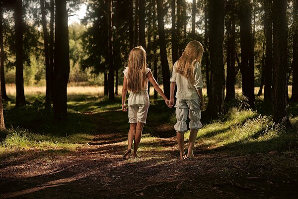 A couple of girls on a forest trail