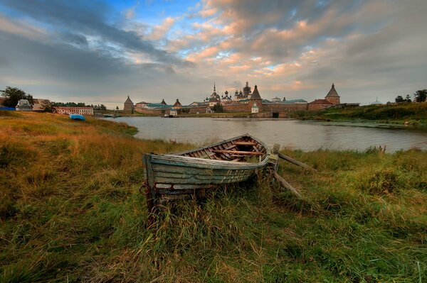 The Cathedral of the Transfiguration of the Saviour Monastery. Boat by the river