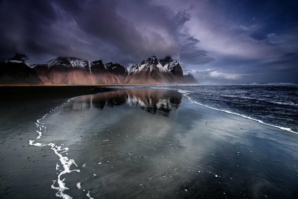 Black sand happens on the beach of Iceland