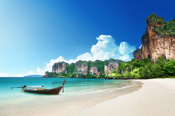 Boat on the shore of a sandy beach