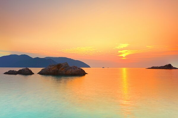 Sunset illuminating the water surface of the sea