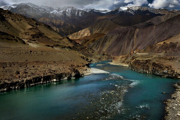 A river among the Himalayan Mountains in India