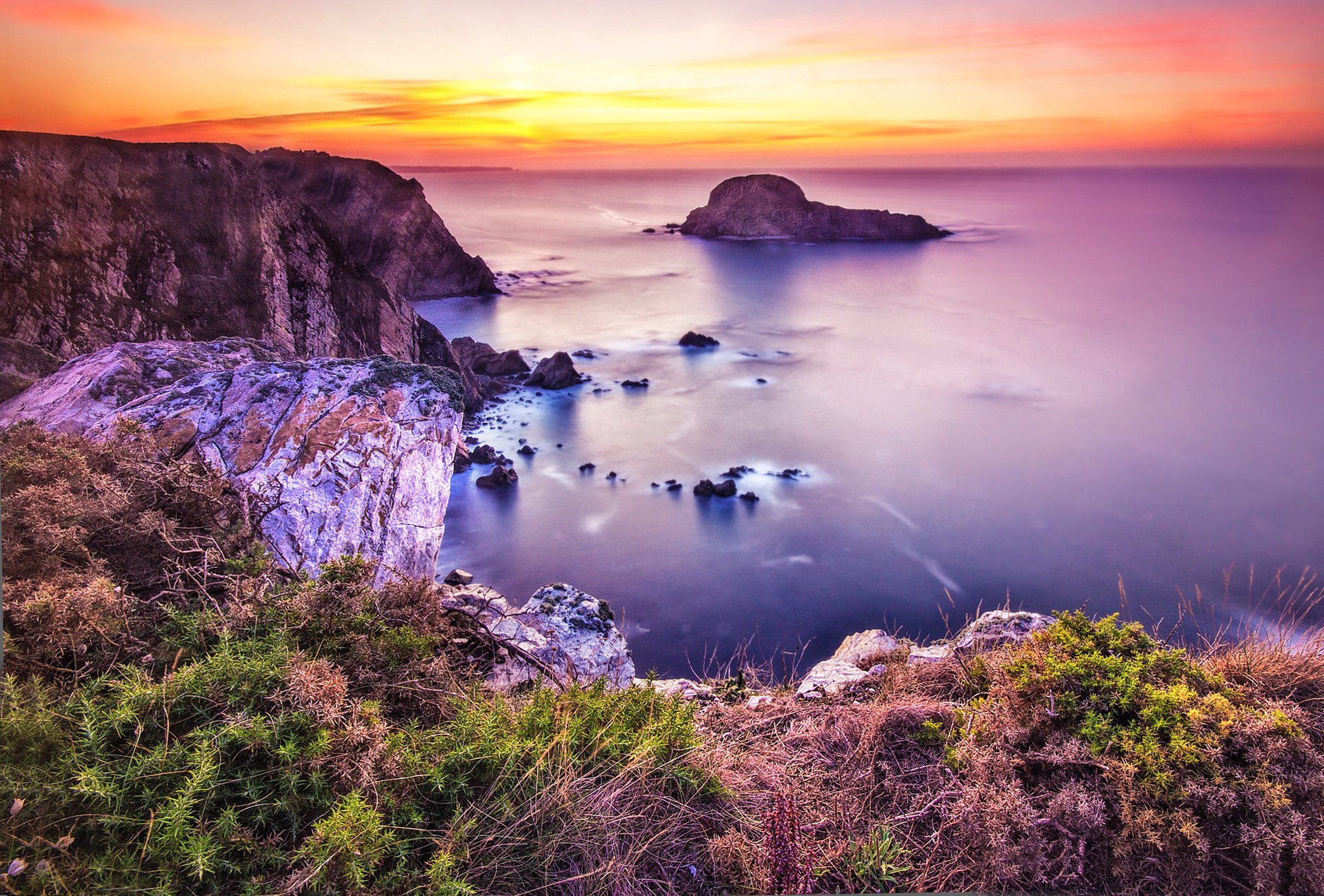 mar costa puesta de sol piedras