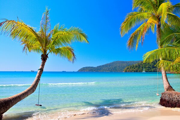 Sunny beach of the emerald coast of tropical paradise