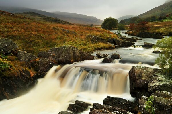 The rapid flow of the river in autumn