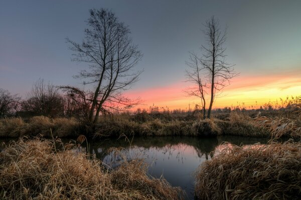 Reflection of sunrise in the lake