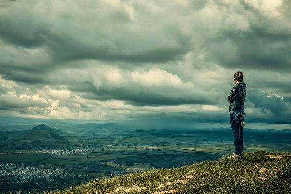 A girl on the mountain admires the landscape of Pyatigorsk