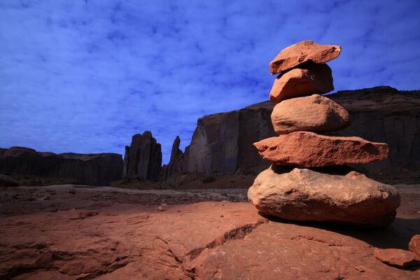 Pyramid of red stones at sunset