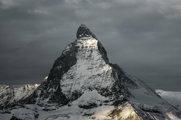 A harsh peak against a gloomy sky