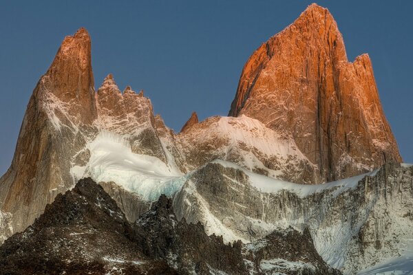 Mountain snow peak on blue