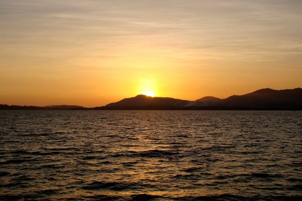 Sunset in Thailand with a view of the islands