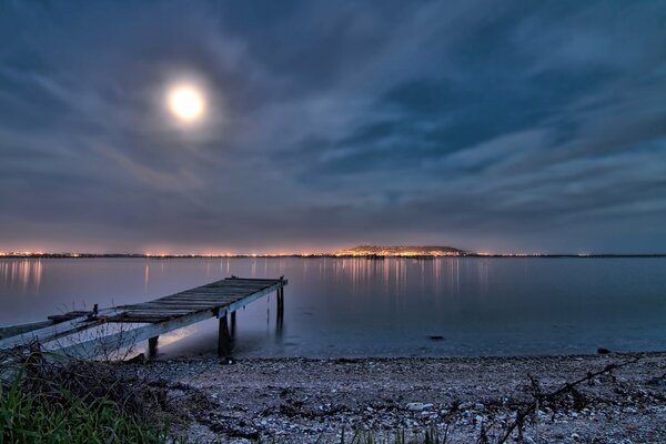 Night France. Pier on the seashore