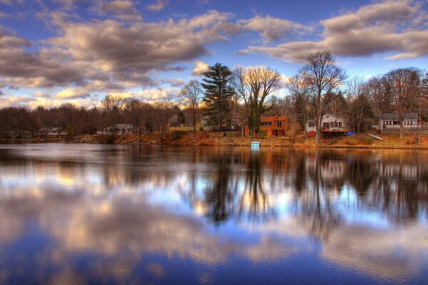 Beautiful photo of a house on the river bank