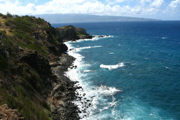 Sea surf on the background of hills