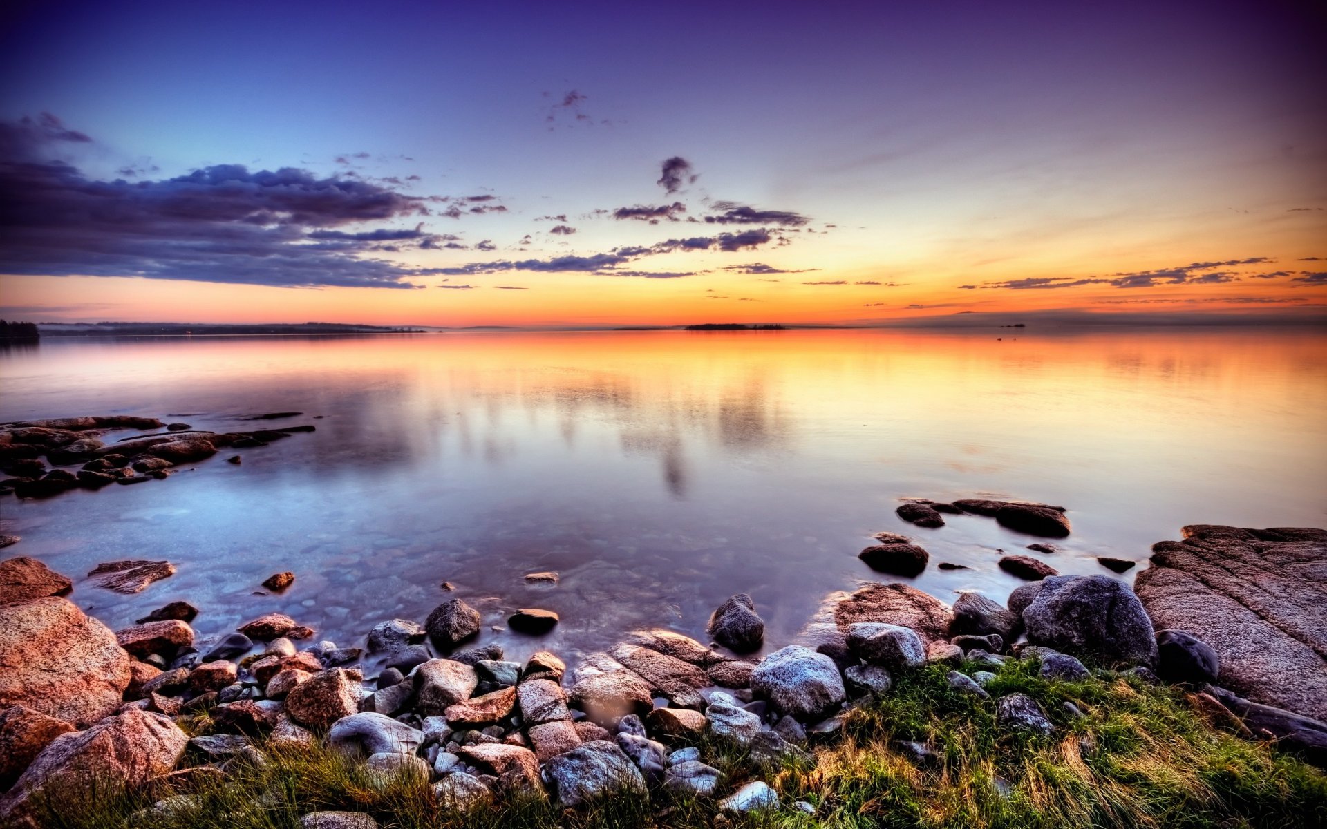 pierres côte coucher de soleil lac nuages