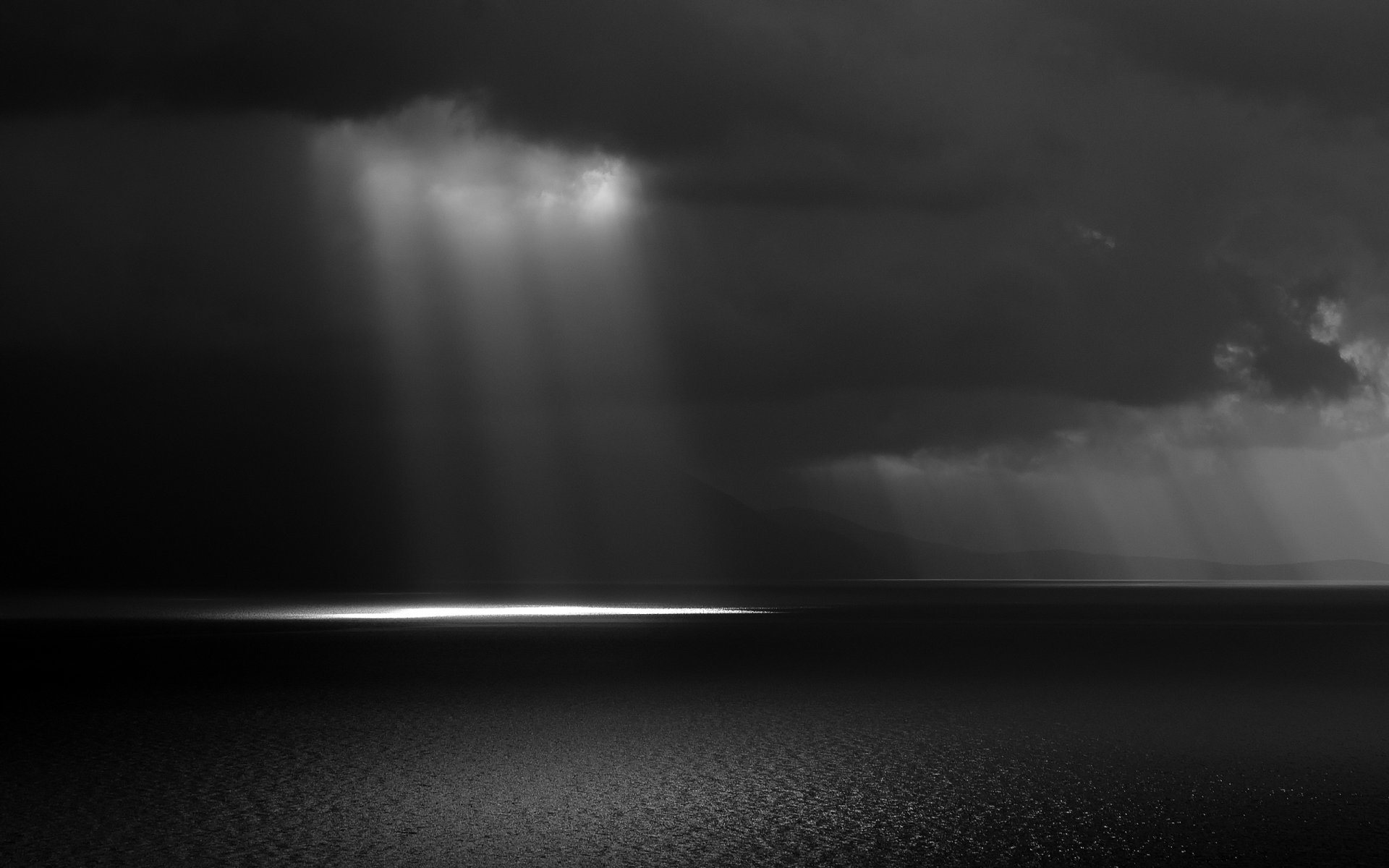 black and white clouds sea sky rays light