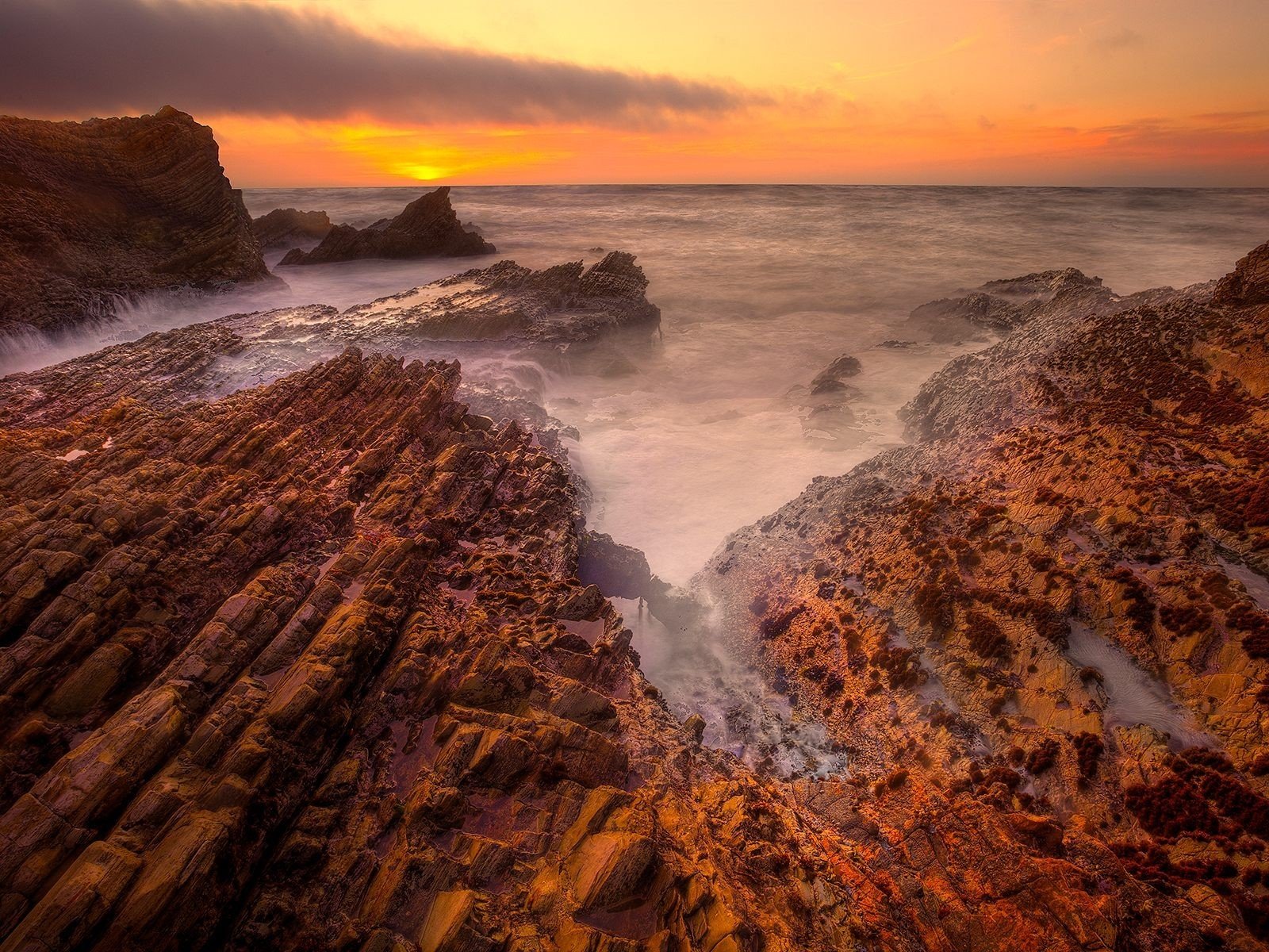 rock beach sea sunset