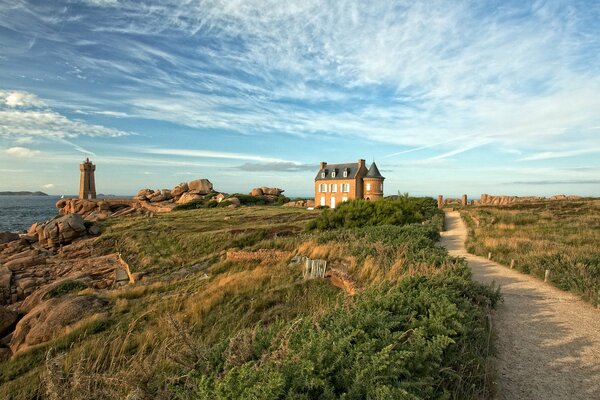 The road to the lighthouse against the high sky