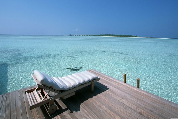 Trestle on the dock in the emerald ocean